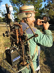 Photo of Mick with a ridiculous contraption strapped to his back.